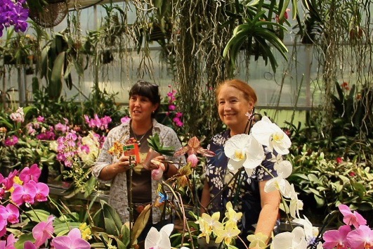 Andrea Ridout with Dotty Woodson and her orchids