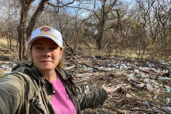 Angel Carter with trash at Fish Creek Linear Park