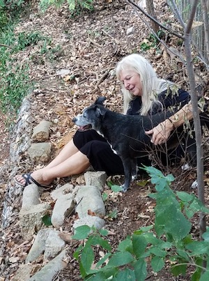 Tammie Carson and dog Baby on the banks of Kee Brook