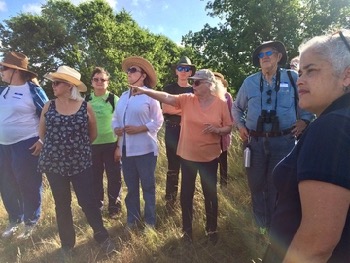 Susan Roberts leads a tour of her prairie